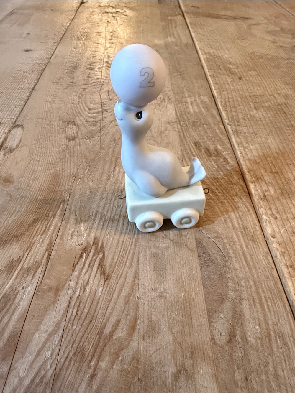 Precious Moments White Seal on Wheeled Base Figurine